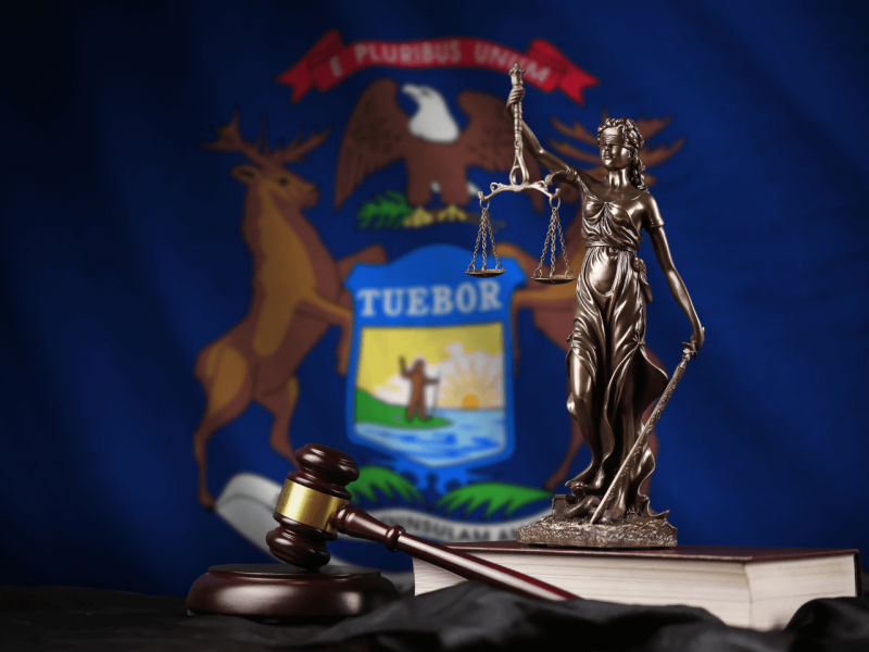 various law-related items including a lady justice statue and a gavel