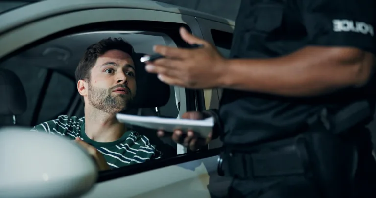 Man, police and stopped car
