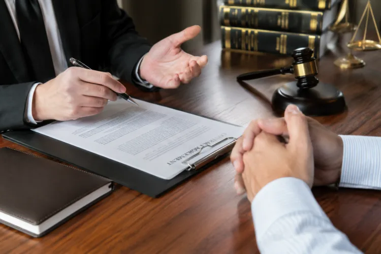 Michigan embezzlement lawyer consulting with client about charge