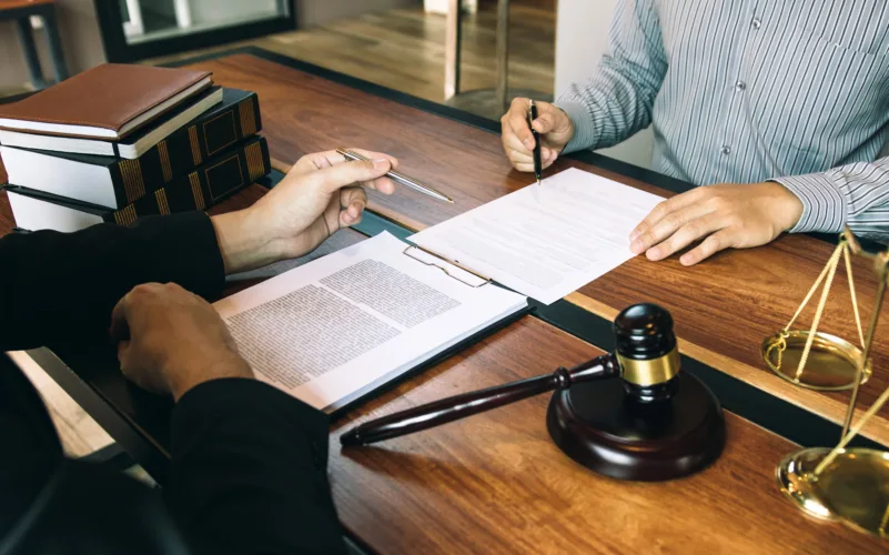 Michigan DUI defense attorney reviewing case evidence with client