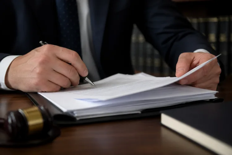 second offense DUI Michigan attorney reviewing case documents