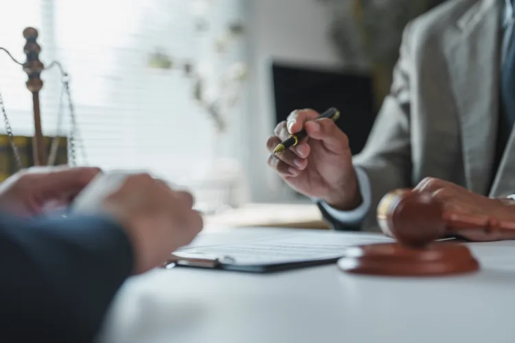 Michigan drugged driving lawyer reviewing case with client