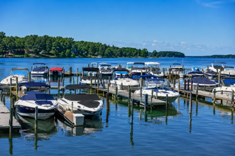 Recreational boats docked at a marina on Lake St. Clair in Harrison Township Michigan on a sunny summer day